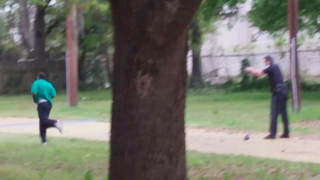 Video screenshot shows then-Police Officer Michael Slager with his gun drawn as Walter Scott runs from him April 4, 2015, in North Charleston, S.C.